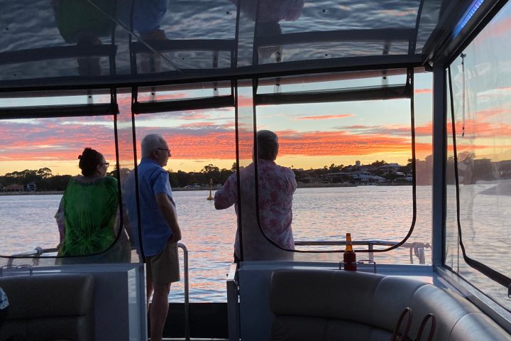a group of people in a boat on a body of water