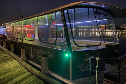 a group of people sitting at a train station