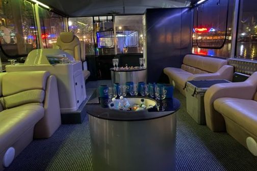 a living room filled with furniture and a large window